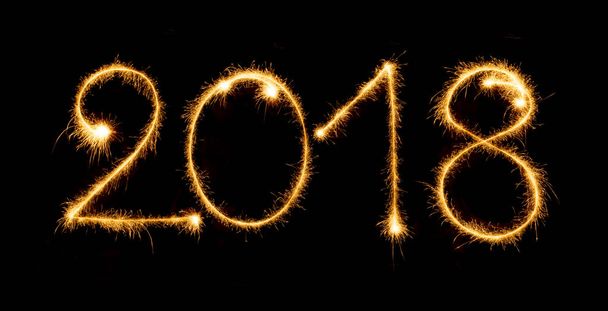 2018 with sparklers on black background - Foto, Bild