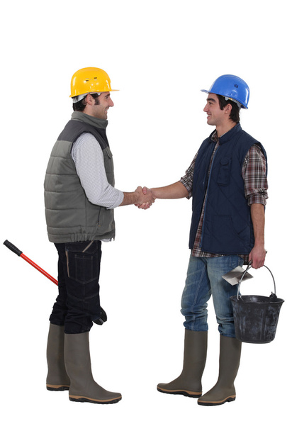 Construction workers shaking hands - Photo, Image