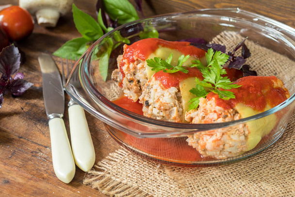 Cooked stuffed pepper served in a transparent glass pot - Photo, Image
