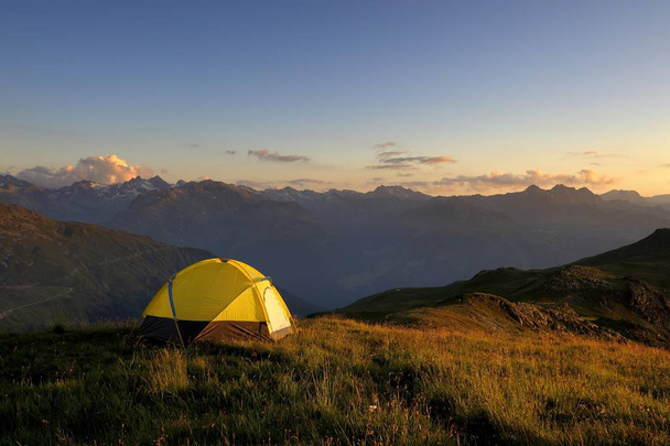 Tent in front of a mountain range in the last daylight, Gaschurn, Montafon, Vorarlberg, Austria, Europe - Fotó, kép