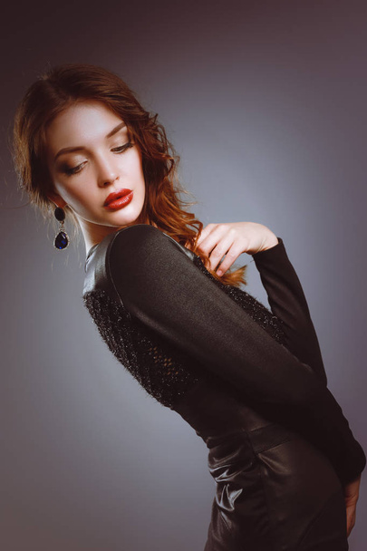 Beautiful woman with evening make-up in black dress - Fotoğraf, Görsel