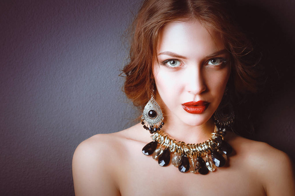 Beautiful woman with evening make-up in black dress - Valokuva, kuva