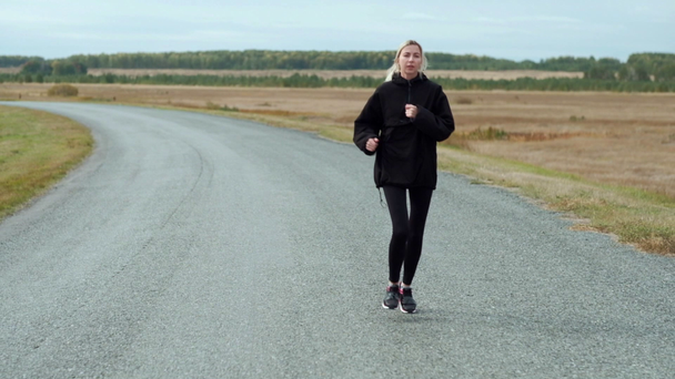 Morgens joggen attraktive junge Blondine - Filmmaterial, Video