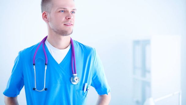Doctor with stethoscope standing , on white background - Valokuva, kuva