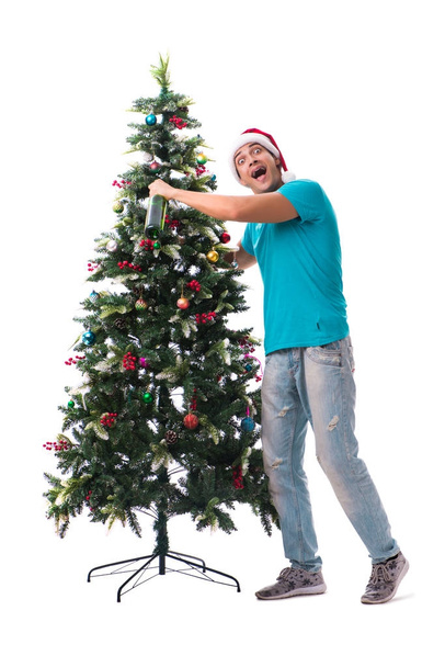 Young man decorating christmas tree isolated on white - Foto, imagen