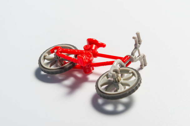 Small broken toy bicycle  - Фото, изображение