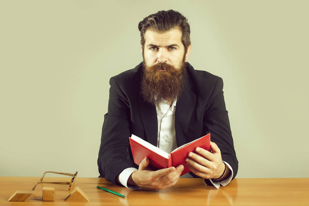 bearded man teacher at table - Foto, Bild