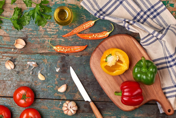Include fresh organic vegetables and wood cutting board on wooden floor with copy space still life - Foto, Imagen