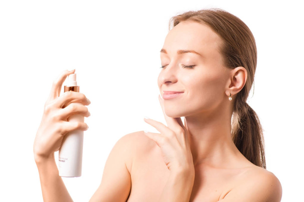 Beautiful woman face spray on face lotion cosmetology - Fotó, kép