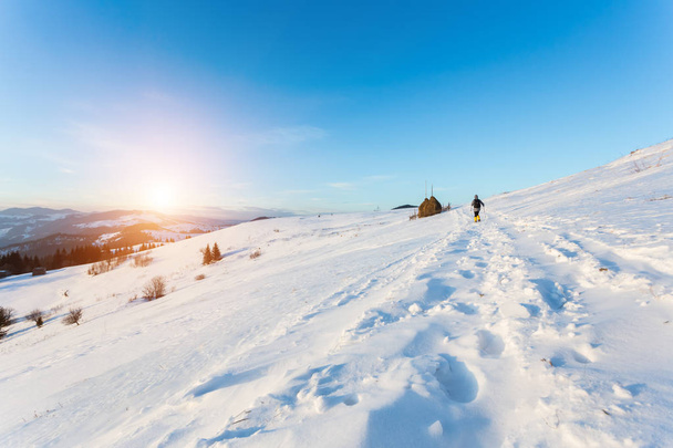 Hiker in winter mountains - Fotoğraf, Görsel