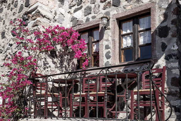 Small typical terrace with flowers at the house in Pyrgos - Photo, Image