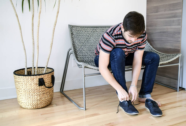 Man putting on his shoes - Photo, image