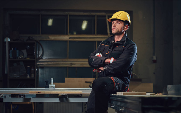 Carpenter male in a workshop. - Photo, Image