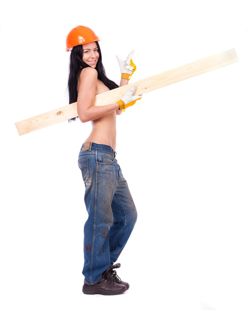 Topless girl in working clothes in the orange helmet - 写真・画像