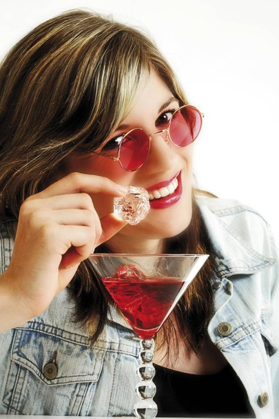 Young woman with pink sun glasses and cocktail, isolated on white background - Valokuva, kuva