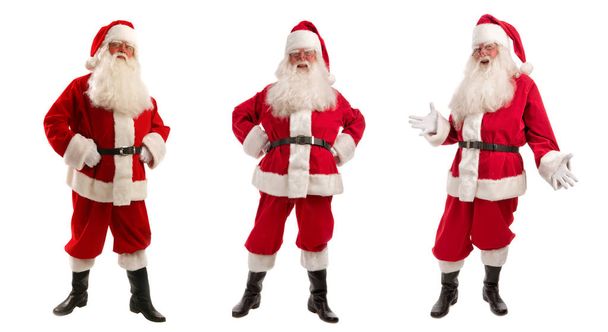 Три Санта-Клауса в рождественском костюме - полная длина
 - Фото, изображение