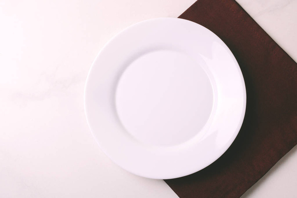 Food background. White empty plate,  napkin. Top view, copyspace - Foto, Imagem