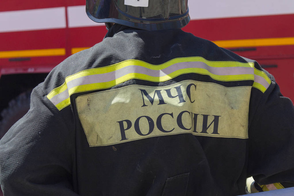 Rescuer in uniform with the inscription "Ministry of Internal Affairs of Russia" in Russian - Photo, Image