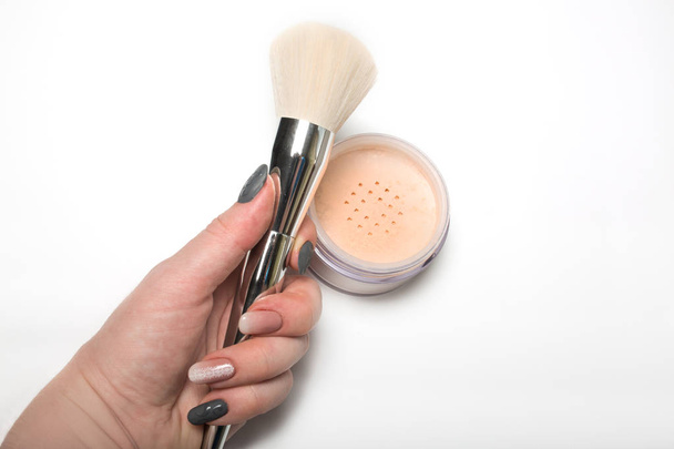 Woman's hand hoding cosmetic brush for powder - Photo, Image