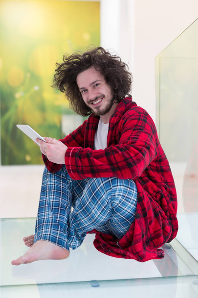 Freelancer in bathrobe working from home - Фото, зображення