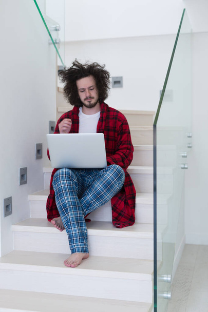 Freelancer in bathrobe working from home - Zdjęcie, obraz