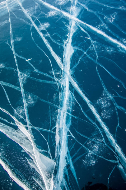 Cracks in ice. Winter in Siberia, Baikal Lake. - Zdjęcie, obraz