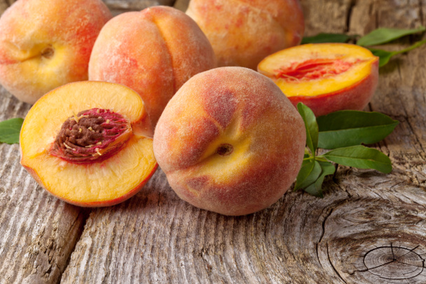 Group of fresh peaches on wood background - Photo, Image