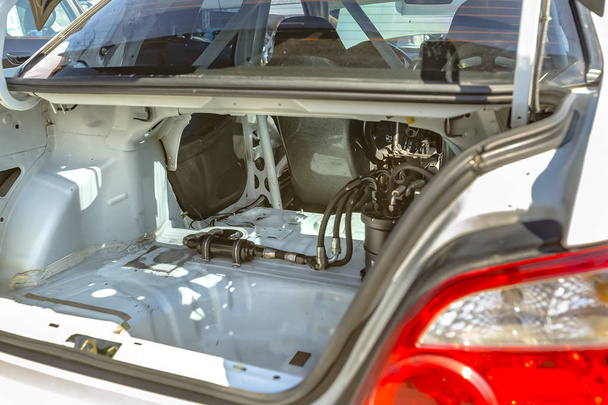 Trunk view of a stripped car with most interior components remov - Photo, Image
