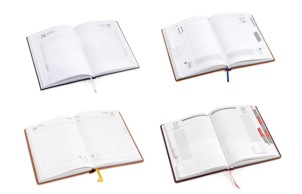 Четыре различных открытых многоязычных бизнес-дневника
  - Фото, изображение