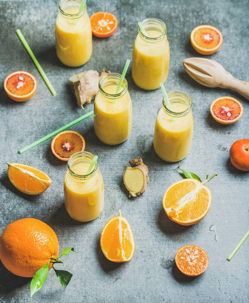 Healthy yellow smoothie in bottles  - Foto, immagini