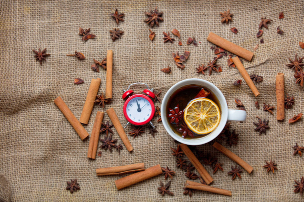 Cup of Christmas tea with alarm clock - Photo, Image