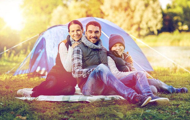 happy family with tent at camp site - Valokuva, kuva