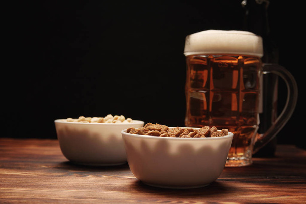 Beer light in a mug and snack - Photo, Image