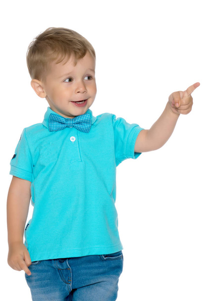 Little boy is showing a finger - Fotó, kép