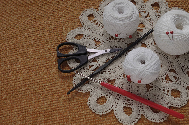 Objects for sewing. Scissors and pins. Hanks thread on mat. Pins - Photo, Image