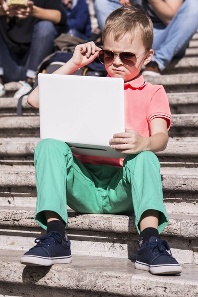 funny boy playing a laptop  - Zdjęcie, obraz
