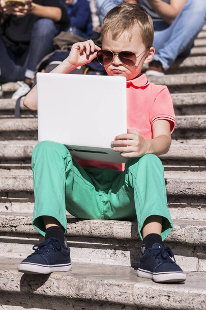 funny boy playing a laptop  - Фото, зображення