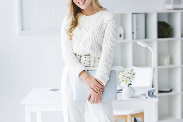 businesswoman in white clothes with laptop - Foto, imagen