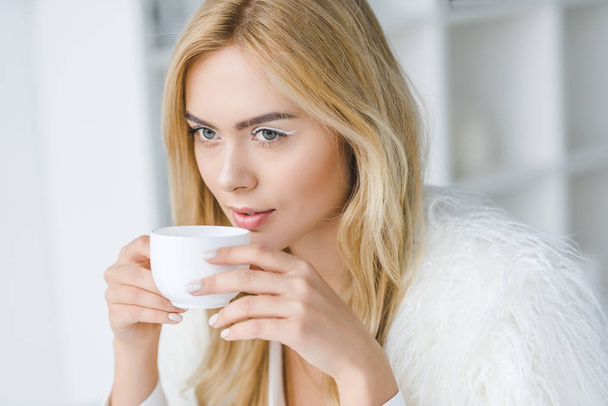 elegant woman drinking coffee - Fotó, kép