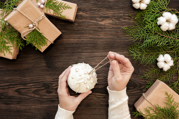 Female hands holding a christmas ball - Foto, immagini