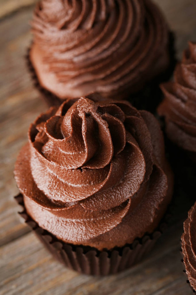 Chocolate cupcakes on grey wooden table - Zdjęcie, obraz