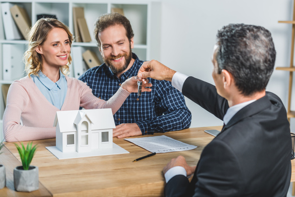 couple getting keys from realtor - Photo, Image