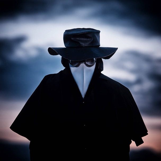 Plague doctor in sunset. Outdoor portrait. - Photo, Image