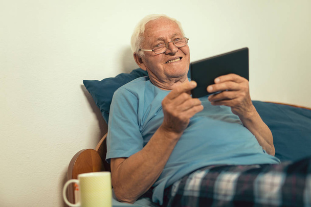 senior man using digital tablet  - Fotó, kép