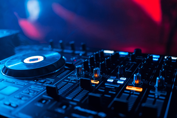 mixer DJ to play at party in nightclub for discs and playing music from levels and volume closeup - Foto, imagen