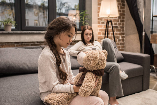 daughter with teddy bear at home - Fotoğraf, Görsel