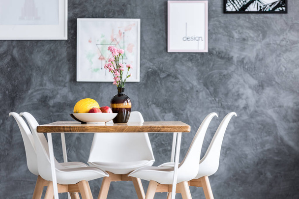 Dining table against concrete wall - Valokuva, kuva