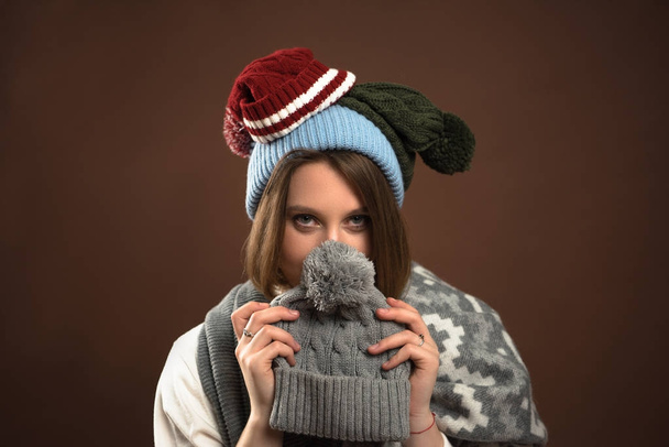 Woman looking out from winter hat - Photo, Image