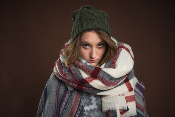 Upset girl in winter clothes - Foto, afbeelding