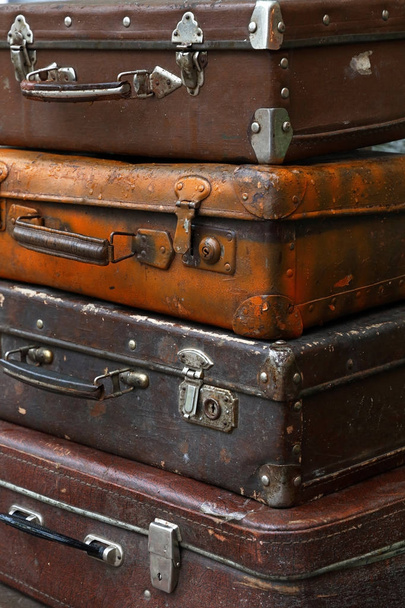 Stack of old vintage travel suitcases close up - Фото, зображення